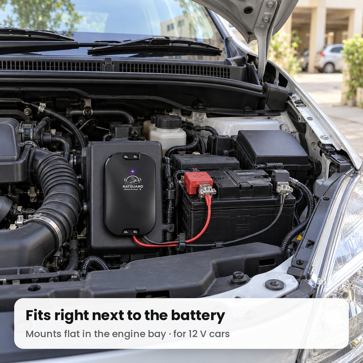SonicArmor X installed next to the battery in a hatchback engine bay